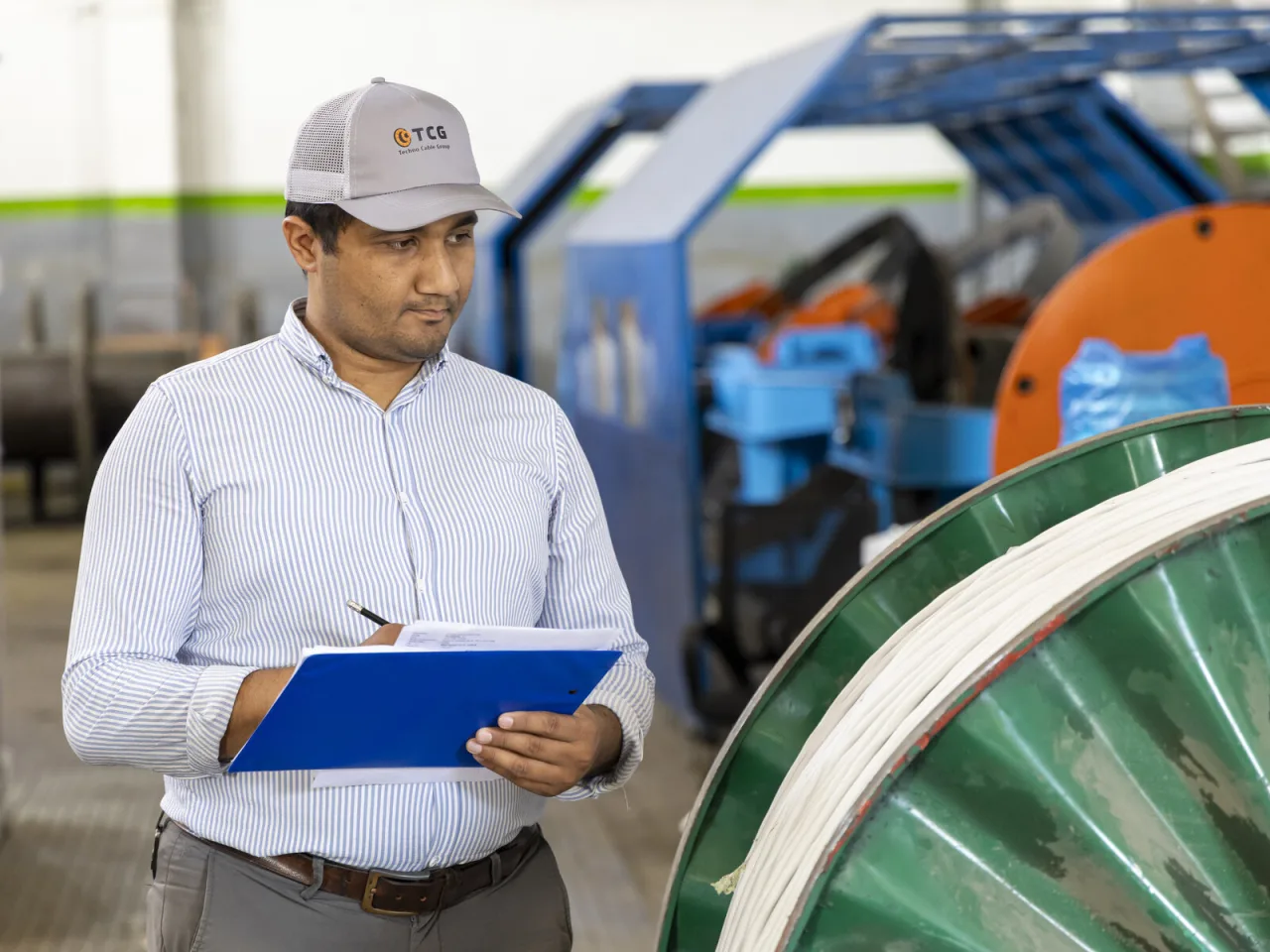 A quality control inspector checks a batch of cable at the Techno Cable Group plant