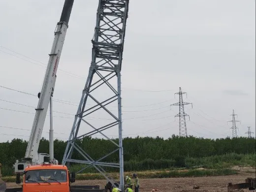 Erecting a tower with a crane